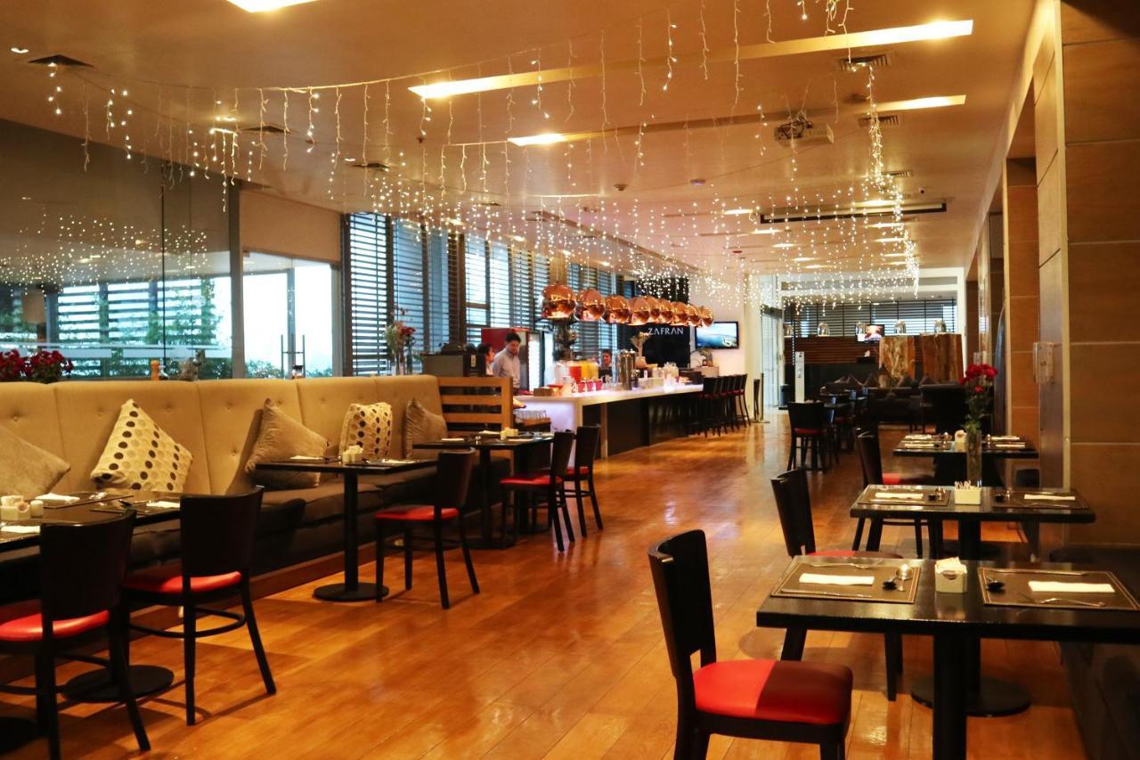 Wyndham Concepcion Pettra Hotell Eksteriør bilde The interior of the restaurant
